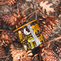 Woodland Friends Enamel Mug 16oz with forest animal design, surrounded by pinecones. Perfect for outdoor adventures. Trek Light.