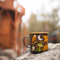 Charming Trek Light enamel mug with woodland animals design on a stone, perfect for a nature-loving outdoor adventure.