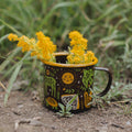 Woodland Friends Enamel Mug 16oz with vibrant forest design and wildflowers, perfect for outdoor adventures - Trek Light.