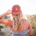 You Are My Sunshine Hat worn by a woman in a sunny outdoor setting, highlighting comfort and style.