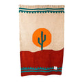 Handwoven Arizona Blanket with cactus design, made from recycled materials, inspired by Southwest landscapes; cozy, beautiful, versatile, by Trek Light.