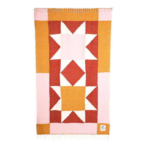 Bernie Blanket: cozy, handwoven quilt, made from recycled clothing materials, featuring a beautiful geometric design. By Trek Light.