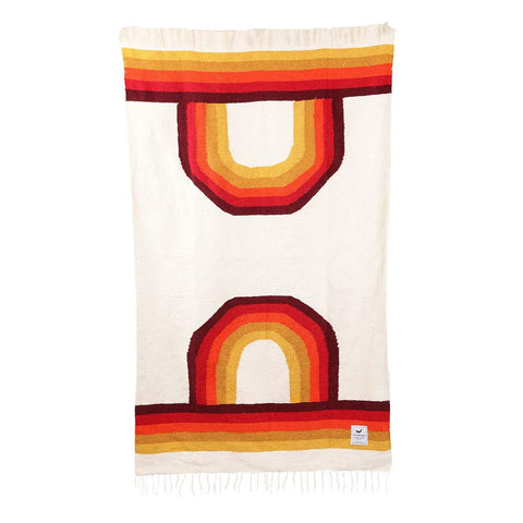 Trek Light handwoven blanket with vibrant red and yellow stripes, eco-friendly and made from recycled materials.