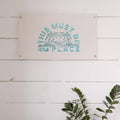 Beautiful 'This Must Be The Place' canvas flag with palm design, made of 10oz cotton by Trek Light. Perfect decor with brass grommets.