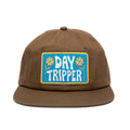 Alt Tag: Trek Light Day Tripper Hat, brown 6-panel snapback with flat brim and colorful patch, unisex 100% cotton twill