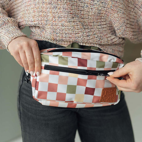 Trek Light Everyday Fanny Pack Checkers converts from hip pack to sling, featuring pockets for organized adventures.