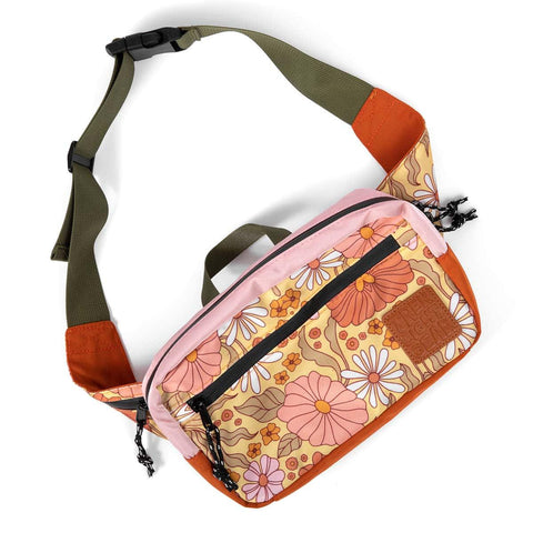 Everyday Fanny Pack (Bloom) by Trek Light - versatile hip pack with floral design converts to a shoulder sling for stylish carrying.