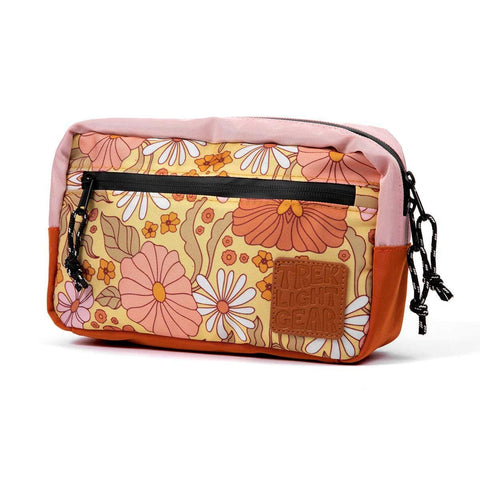 Trek Light Everyday Fanny Pack in floral design, water-resistant, versatile for hip or shoulder wear, perfect for daily adventures.