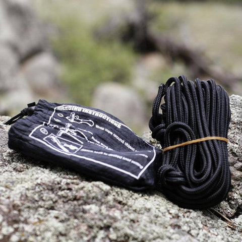 Trek Light Go Anywhere Rope Kit on rocks, lightweight and knotted, ready for hammock setup. Perfect for outdoor adventure gear.