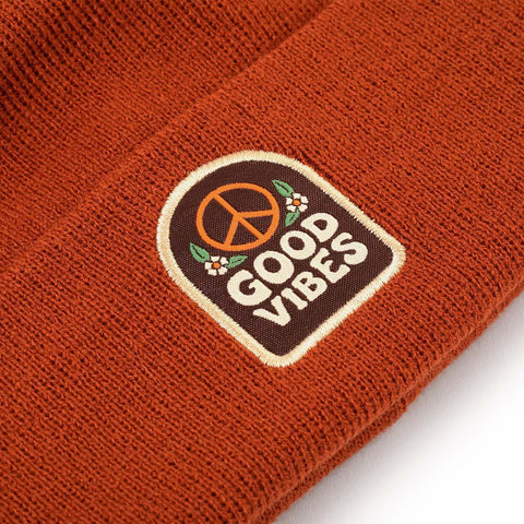 Good Vibes Kids Beanie by Trek Light, cozy rust-brown hat with peace symbol patch, perfect for spreading good vibes and warmth.