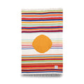 Colorful handwoven blanket with orange circle, part of Trek Light's eco-friendly Blanket + Leather Carrier Bundle.