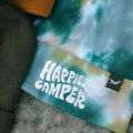 Tie dye beanie with 'Happiest Camper' design by Trek Light, showcasing colorful and cozy style.