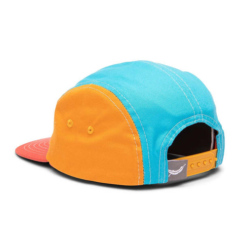 Colorful Happiest Camper Kids Snapback Hat with flat brim, featuring blue, orange, and red panels. Trek Light style for adventurous kids.