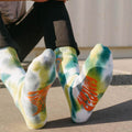 Colorful tie dye socks with Camper graphics, perfect for adventurous souls. Features genuine tie dye design by Trek Light Gear.