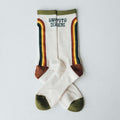 Happy To Be Here socks by Trek Light, featuring colorful stripes and green accents, designed for comfort and breathability.