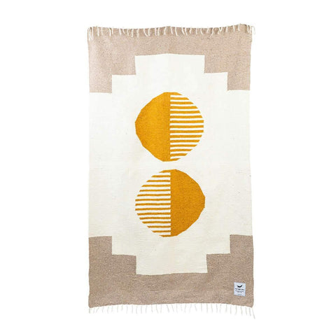 Trek Light Horizon Blanket handwoven from recycled materials featuring unique geometric design in beige and mustard tones.