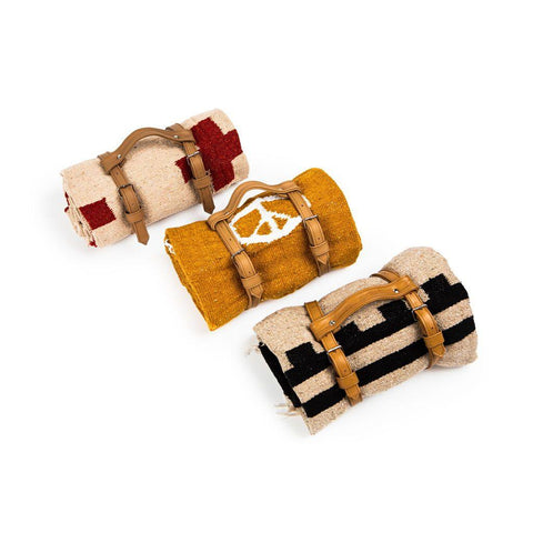 Trek Light Blanket and Leather Carrier Bundle featuring handwoven blankets with eco-friendly, reclaimed leather straps.