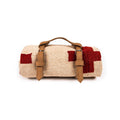 Trek Light blanket with handcrafted leather carrier bundle, featuring a red and beige handwoven design, perfect for eco-friendly adventures.