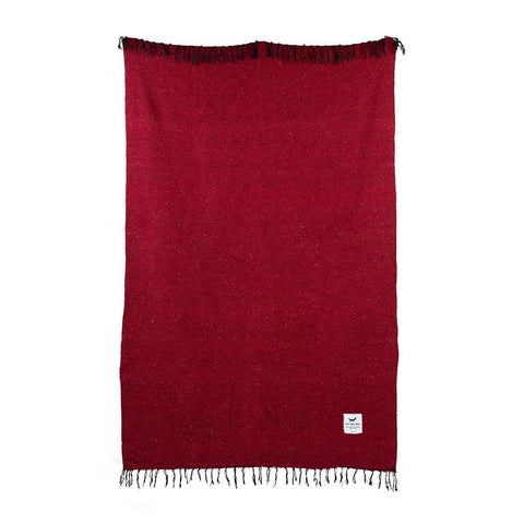 Napa Blanket by Trek Light in rich red, handwoven from recycled materials, eco-friendly and perfect for cozy naps.