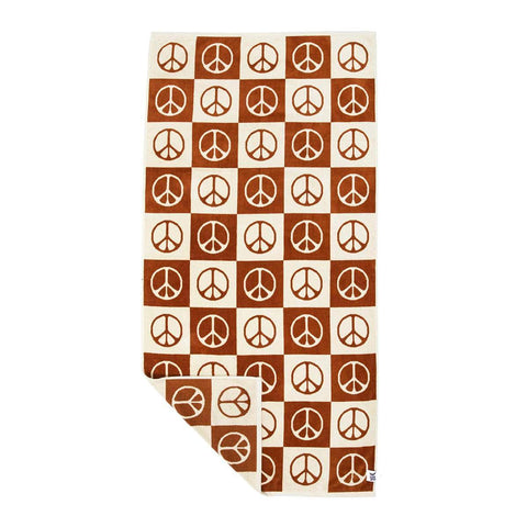 Trek Light Peace Bath Towel with peace symbols in brown and cream, made from sustainably sourced cotton for soft, cozy comfort.