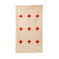 Trek Light handwoven blanket with red crosses, made from 100% recycled materials.