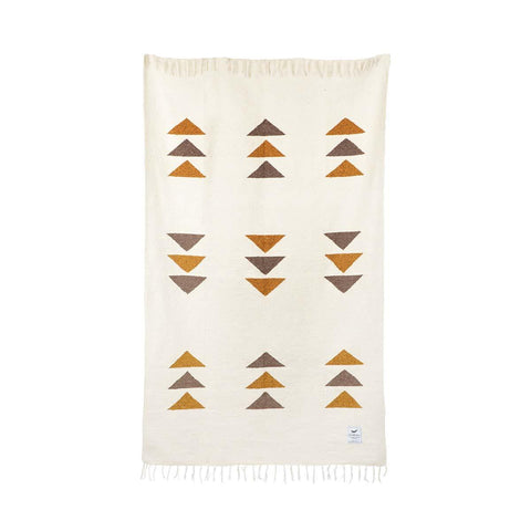 Handwoven blanket with geometric pattern, part of Trek Light's eco-friendly bundle with handcrafted leather carrier. Sustainable choice.