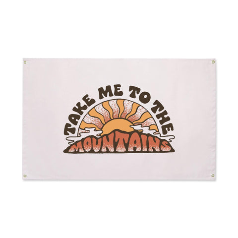 Trek Light's "Take Me To The Mountains" canvas flag with retro sun design, perfect for mountain therapy and adventure vibes.