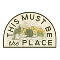 Trek Light desert sticker, 'This Must Be The Place' design, showcasing cactus and sunset, weatherproof vinyl.