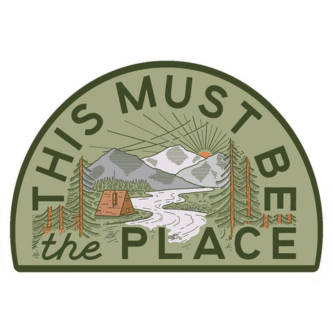 This Must Be The Place Mountain Sticker with A-Frame Cabin, Trek Light, and nature scene, weatherproof vinyl.